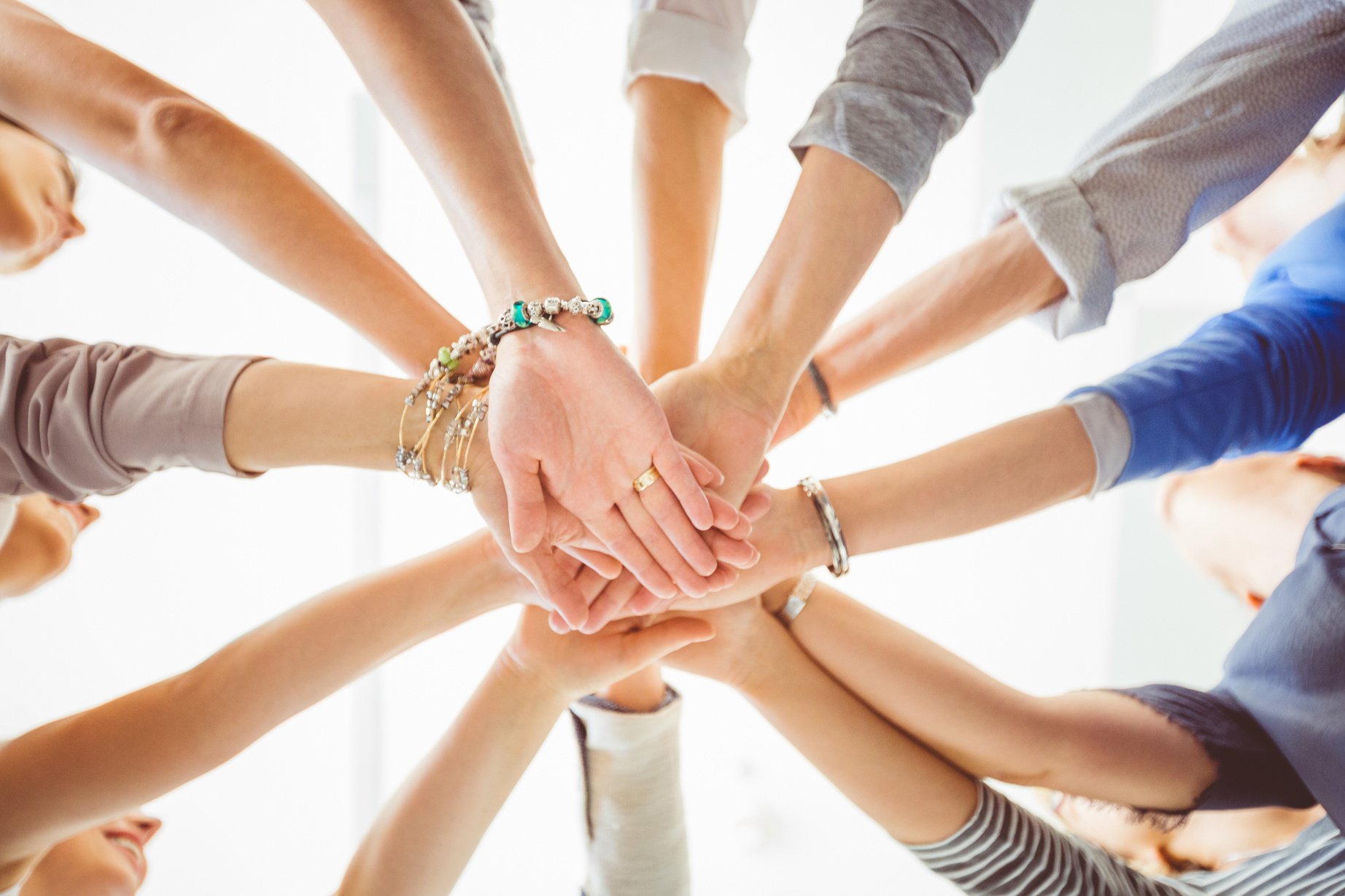 Women’s team. Group of women holding hands